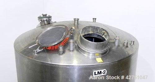 Used Tank, 2000 Gallon, 304 Stainless Steel, Vertical. 84" Diameter x 78" straight side, dished top, coned bottom. Openings top (3) 1-1/2", (5) 2" NPT, 3", 6", 15" man way with cover. 3" Threaded cen...