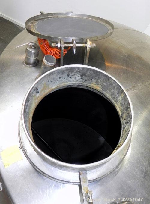 Used Tank, 2000 Gallon, 304 Stainless Steel, Vertical. 84" Diameter x 78" straight side, dished top, coned bottom. Openings top (3) 1-1/2", (5) 2" NPT, 3", 6", 15" man way with cover. 3" Threaded cen...