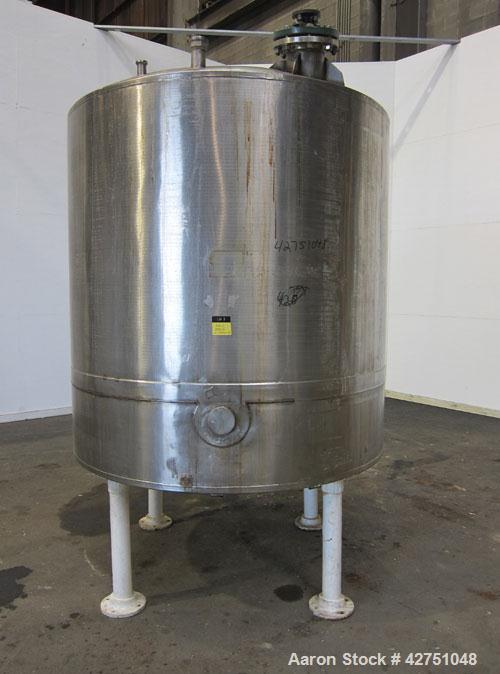 Used Tank, 1000 Gallon, 304 Stainless Steel, Vertical. 66" Diameter x 64" straight side, dished top, coned bottom. Off center top entering Lightnin agitator model N33G-75. 1-1/2" Diameter shaft with ...