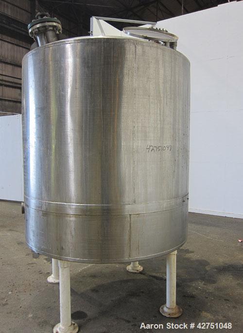 Used Tank, 1000 Gallon, 304 Stainless Steel, Vertical. 66" Diameter x 64" straight side, dished top, coned bottom. Off center top entering Lightnin agitator model N33G-75. 1-1/2" Diameter shaft with ...