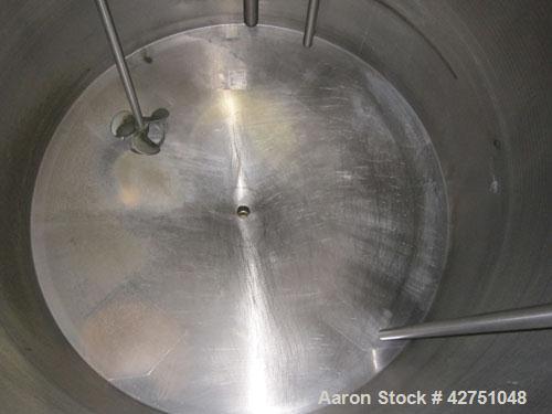 Used Tank, 1000 Gallon, 304 Stainless Steel, Vertical. 66" Diameter x 64" straight side, dished top, coned bottom. Off center top entering Lightnin agitator model N33G-75. 1-1/2" Diameter shaft with ...