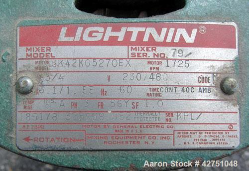 Used Tank, 1000 Gallon, 304 Stainless Steel, Vertical. 66" Diameter x 64" straight side, dished top, coned bottom. Off center top entering Lightnin agitator model N33G-75. 1-1/2" Diameter shaft with ...