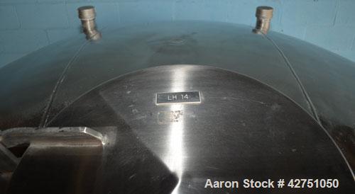 Used Tank, 1000 Gallon, Stainless Steel, Vertical. 66" Diameter x 66" straight side, dished top, coned bottom. Openings top 1-1/2", (2) 2" NPT, (2) 3", 18" man way with cover. 2" Tri-clamp center bot...