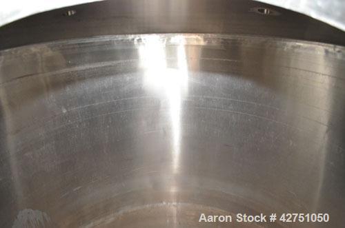 Used Tank, 1000 Gallon, Stainless Steel, Vertical. 66" Diameter x 66" straight side, dished top, coned bottom. Openings top 1-1/2", (2) 2" NPT, (2) 3", 18" man way with cover. 2" Tri-clamp center bot...