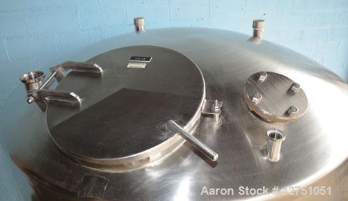Used Tank, 1000 Gallon, Stainless Steel, Vertical. 66" Diameter x 66" straight side, dished top, coned bottom. Openings top 1-1/2", (2) 2" NPT, (2) 3", 18" man way with cover. 2" Tri-clamp center bot...