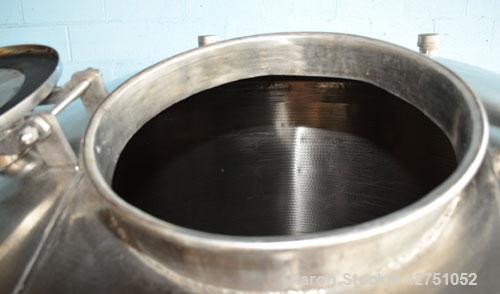Used Tank, 1000 Gallon, Stainless Steel, Vertical. 66" Diameter x 66" straight side, dished top, coned bottom. Openings top 1-1/2", (2) 2" NPT, (2) 3", 18" man way with cover. 2" Tri-clamp center bot...