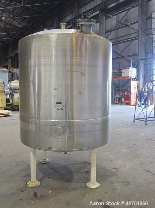 Used Tank, 1000 Gallon, 304 Stainless Steel, Vertical. 66" Diameter x 66" straight side, dished top, coned bottom. Off center top entering Lightnin agitator, model N33G-75, 1-1/2" diameter shaft with...