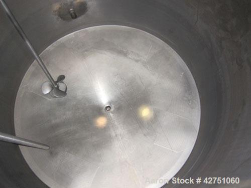 Used Tank, 1000 Gallon, 304 Stainless Steel, Vertical. 66" Diameter x 66" straight side, dished top, coned bottom. Off center top entering Lightnin agitator, model N33G-75, 1-1/2" diameter shaft with...