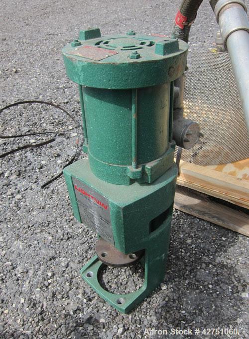 Used Tank, 1000 Gallon, 304 Stainless Steel, Vertical. 66" Diameter x 66" straight side, dished top, coned bottom. Off center top entering Lightnin agitator, model N33G-75, 1-1/2" diameter shaft with...