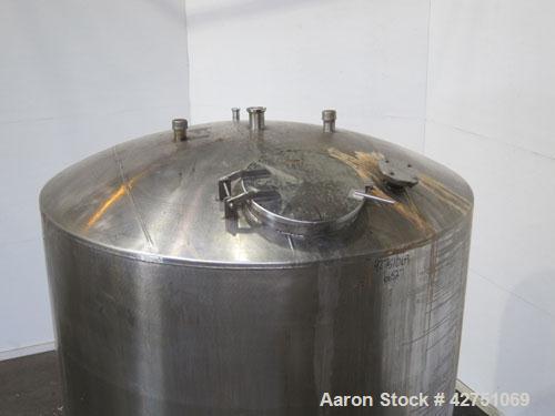 Used Tank, 2000 Gallon, 304 Stainless Steel, Vertical. 84" Diameter x 84" straight side. Dished top, coned bottom. Openings top 1-1/2" tri-clamp, 3", (2) 2" NPT, 6", 18" man way with cover. 2" Thread...