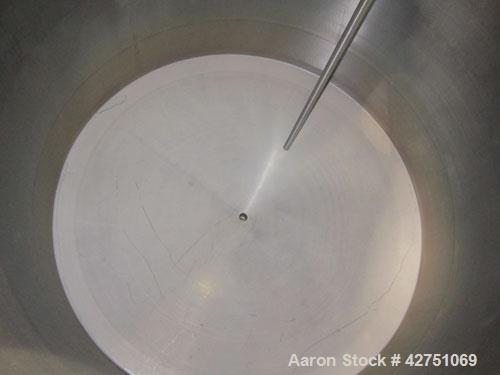 Used Tank, 2000 Gallon, 304 Stainless Steel, Vertical. 84" Diameter x 84" straight side. Dished top, coned bottom. Openings top 1-1/2" tri-clamp, 3", (2) 2" NPT, 6", 18" man way with cover. 2" Thread...