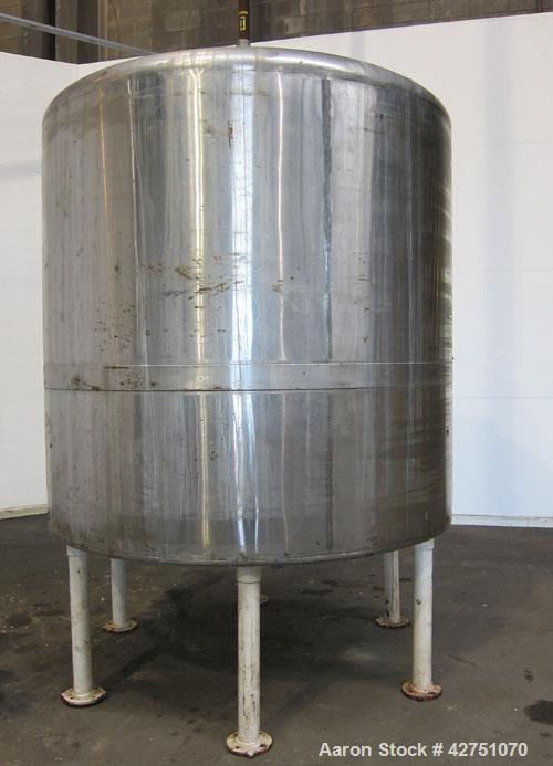 Used Tank, 2000 Gallon, 304 Stainless Steel, Vertical. 84" Diameter x 84" straight side. Dished top, coned bottom. Openings top 1-1/2" tri-clamp, 3", (2) 2" NPT, 6", 18" man way with cover. 2" Thread...