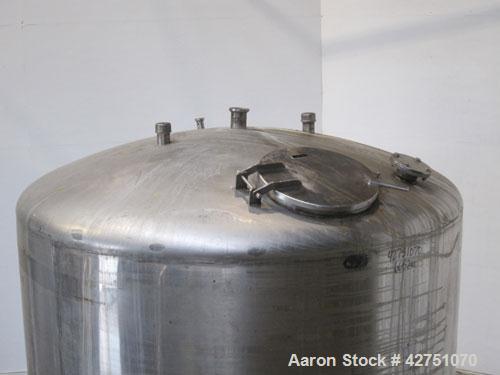 Used Tank, 2000 Gallon, 304 Stainless Steel, Vertical. 84" Diameter x 84" straight side. Dished top, coned bottom. Openings top 1-1/2" tri-clamp, 3", (2) 2" NPT, 6", 18" man way with cover. 2" Thread...