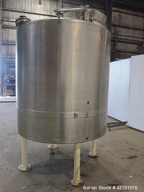 Used Tank, 1000 Gallon, 304 Stainless Steel, Vertical. 66" Diameter x 66" straight side, dished top, coned bottom. Off center top entering Lightnin agitator, Model N33G-75, 1-1/2" diameter shaft with...