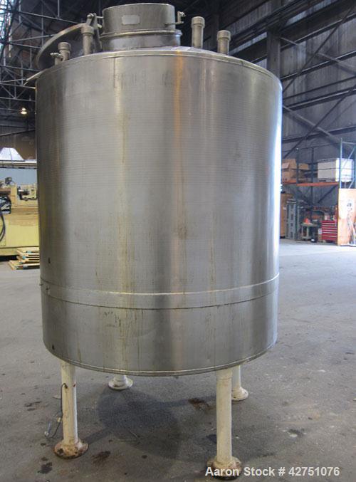 Used Tank, 1000 Gallon, 304 Stainless Steel, Vertical. 66" Diameter x 66" straight side, dished top, coned bottom. Off center top entering Lightnin agitator, Model N33G-75, 1-1/2" diameter shaft with...