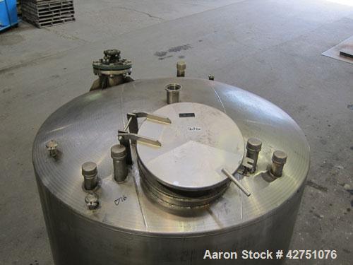 Used Tank, 1000 Gallon, 304 Stainless Steel, Vertical. 66" Diameter x 66" straight side, dished top, coned bottom. Off center top entering Lightnin agitator, Model N33G-75, 1-1/2" diameter shaft with...