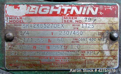 Used Tank, 1000 Gallon, 304 Stainless Steel, Vertical. 66" Diameter x 66" straight side, dished top, coned bottom. Off center top entering Lightnin agitator, Model N33G-75, 1-1/2" diameter shaft with...