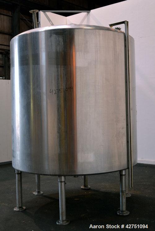 Used Tank, 2000 Gallon, 304 Stainless Steel Vertical. 84” Diameter x 80” straight side. Dished top, coned bottom. Off center top entering Lightnin air operated agitator, model XJAC-100. 1-1/2” Diamet...