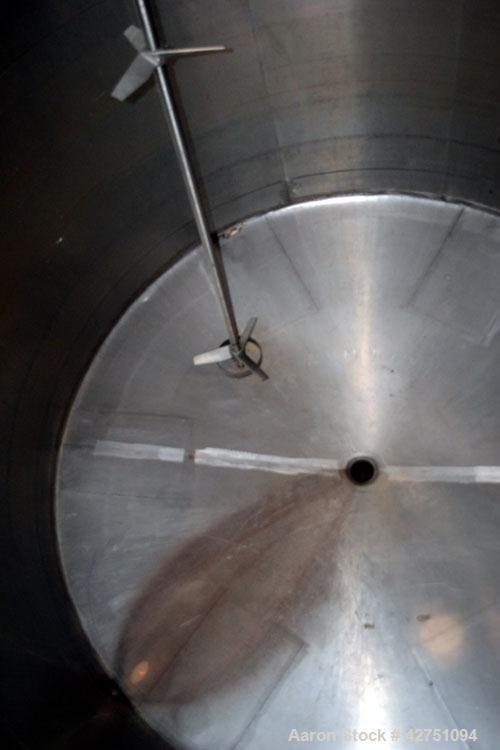 Used Tank, 2000 Gallon, 304 Stainless Steel Vertical. 84” Diameter x 80” straight side. Dished top, coned bottom. Off center top entering Lightnin air operated agitator, model XJAC-100. 1-1/2” Diamet...