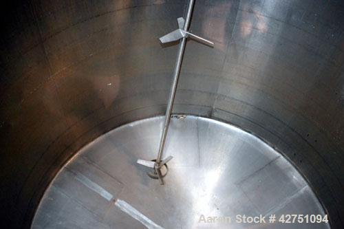 Used Tank, 2000 Gallon, 304 Stainless Steel Vertical. 84” Diameter x 80” straight side. Dished top, coned bottom. Off center top entering Lightnin air operated agitator, model XJAC-100. 1-1/2” Diamet...