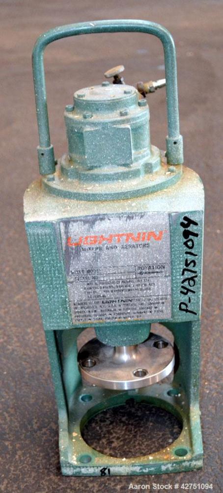 Used Tank, 2000 Gallon, 304 Stainless Steel Vertical. 84” Diameter x 80” straight side. Dished top, coned bottom. Off center top entering Lightnin air operated agitator, model XJAC-100. 1-1/2” Diamet...