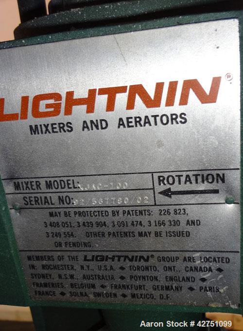 Used Tank, 2000 Gallon, 304 Stainless Steel Vertical. 84” Diameter x 80” straight side. Dished top, coned bottom. Off center top entering Lightnin air operated agitator, model XJAC-100. 1-1/2” Diamet...