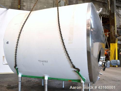 Used Storage Tank, 3000 Gallon, 304 Stainless Steel, Horizontal. 90" Diameter x 96" straight side, dished heads. Insulated with carbon steel sheathing. Partial jacket, no rating. (1) Spray ball. Side...