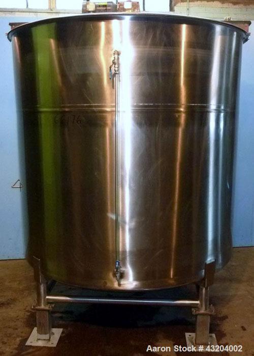 Used Tank, 1,200 Gallon, Stainless Steel, Vertical. Open top with lids, dished bottom. Side mounted level gauge and bridge mounted 1 hp agitator.  1-1/2’’ Center bottom outlet.  Mounted on (4) stainl...