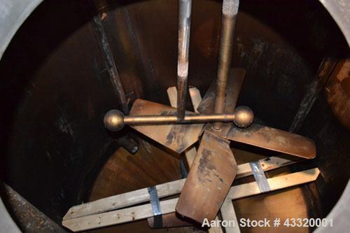 Used Tank, 1500 Gallon, 316 Stainless Steel, Vertical. Approximate 76” diameter x 72” straight side, dished top and bottom. Fixed stainless steel agitator mount with a UET agitator, model XCEL-6, out...