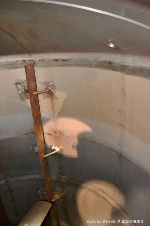 Used Tank, 1900 Gallon, 316 Stainless Steel, Vertical. Approximate 76” diameter x 92” straight side, dished top and bottom. Fixed stainless steel agitator mount with a UET agitator, model XCEL-6, out...