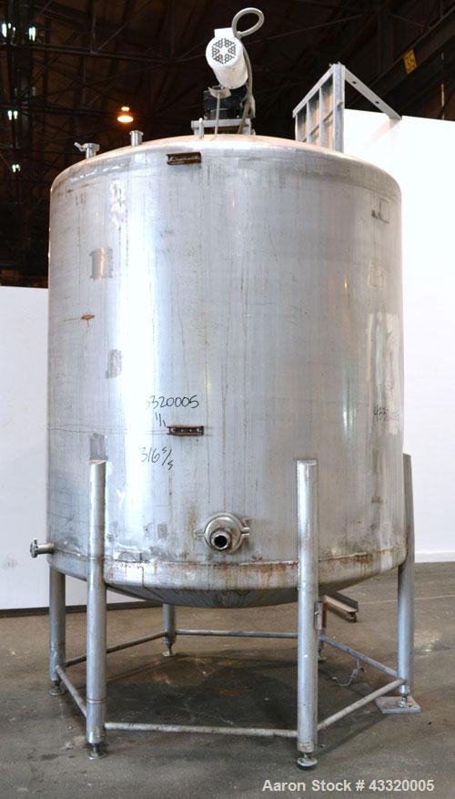 Used Tank, 1500 Gallon, 316 Stainless Steel, Vertical. Approximate 76” diameter x 72” straight side, dished top and bottom. Fixed stainless steel agitator mount with a UET agitator, model XCEL-6, out...