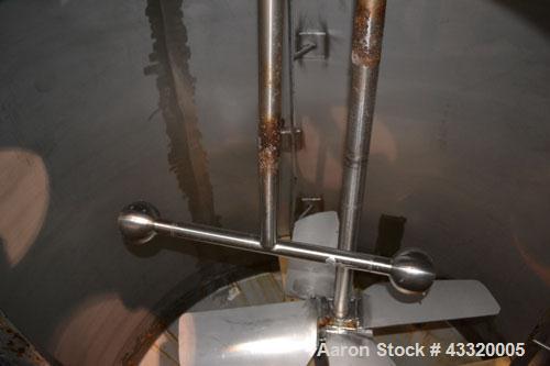 Used Tank, 1500 Gallon, 316 Stainless Steel, Vertical. Approximate 76” diameter x 72” straight side, dished top and bottom. Fixed stainless steel agitator mount with a UET agitator, model XCEL-6, out...