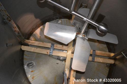 Used Tank, 1500 Gallon, 316 Stainless Steel, Vertical. Approximate 76” diameter x 72” straight side, dished top and bottom. Fixed stainless steel agitator mount with a UET agitator, model XCEL-6, out...