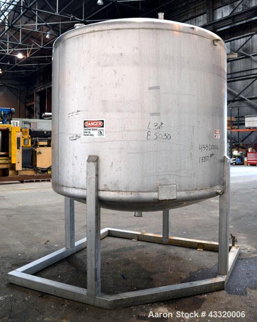 Used Tank, 1650 Gallon, 316 Stainless Steel, Vertical. Approximate 84” diameter x 60” straight side, dished top and bottom. Openings top 2” tri-clamp, (4) 3” tri-clamp, 2-1/2” tri-clamp, 23” man way ...