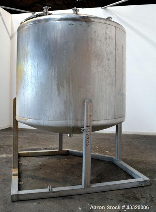Used Tank, 1650 Gallon, 316 Stainless Steel, Vertical. Approximate 84” diameter x 60” straight side, dished top and bottom. Openings top 2” tri-clamp, (4) 3” tri-clamp, 2-1/2” tri-clamp, 23” man way ...