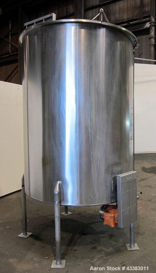 Used Tank, 1000 Gallon, 304 Stainless Steel, Vertical. Approximate 61” diameter x 81” straight side, flat top with a bolt on cover with a 1/3 hinged opening, sloped bottom. Side bottom entering agita...