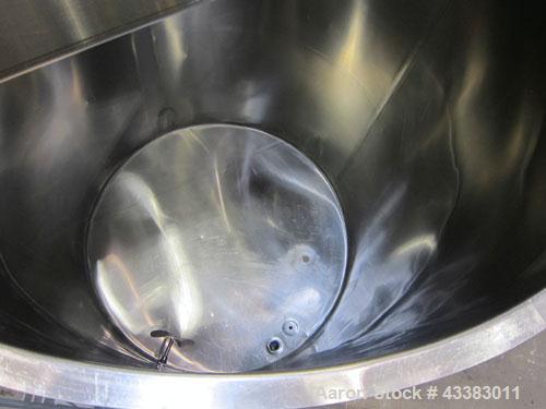 Used Tank, 1000 Gallon, 304 Stainless Steel, Vertical. Approximate 61” diameter x 81” straight side, flat top with a bolt on cover with a 1/3 hinged opening, sloped bottom. Side bottom entering agita...