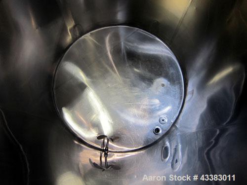 Used Tank, 1000 Gallon, 304 Stainless Steel, Vertical. Approximate 61” diameter x 81” straight side, flat top with a bolt on cover with a 1/3 hinged opening, sloped bottom. Side bottom entering agita...