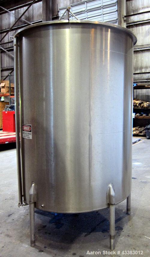 Used- Tank, 1000 Gallon, 304 Stainless Steel, Vertical. Approximate 61” diameter x 81” straight side, flat top with a bolt o...