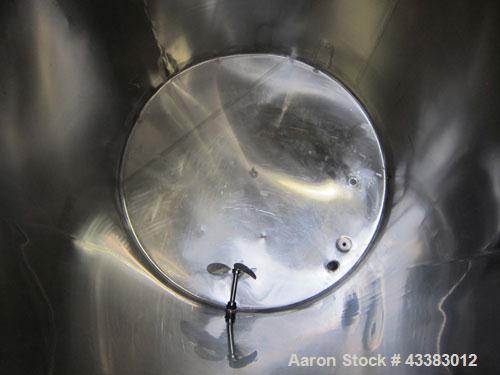 Used Tank, 1000 Gallon, 304 Stainless Steel, Vertical. Approximate 61” diameter x 81” straight side, flat top with a bolt on cover with a 1/3 hinged opening, sloped bottom. Side bottom entering agita...