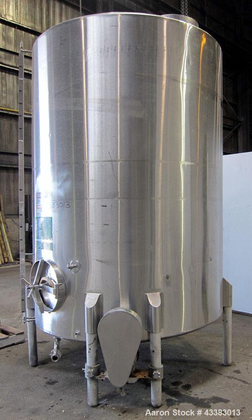 Used Tank, 2225 Gallon, 304 Stainless Steel, Vertical. Approximate 79” diameter x 105” straight side, flat welded top, sloped bottom. Side bottom entering agitator, 3 blade prop driven by a 5hp, 3/60...