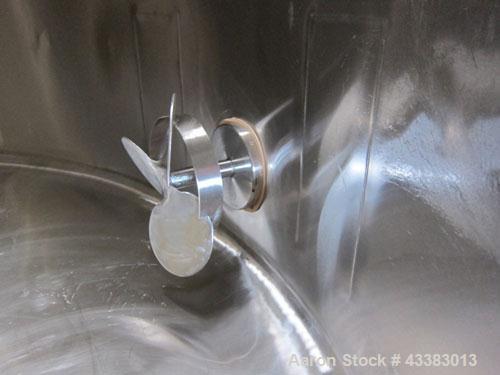 Used Tank, 2225 Gallon, 304 Stainless Steel, Vertical. Approximate 79” diameter x 105” straight side, flat welded top, sloped bottom. Side bottom entering agitator, 3 blade prop driven by a 5hp, 3/60...