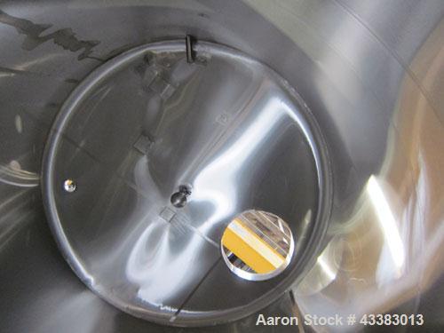 Used Tank, 2225 Gallon, 304 Stainless Steel, Vertical. Approximate 79” diameter x 105” straight side, flat welded top, sloped bottom. Side bottom entering agitator, 3 blade prop driven by a 5hp, 3/60...