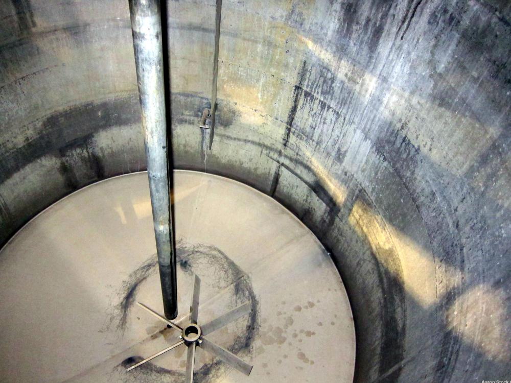 Used Tank, 1100 Gallon, 304 Stainless Steel, Vertical. Approximately 68” diameter x 70” straight side, flat top with (2) 1/3 hinged covers, coned bottom. Fixed stainless steel agitator bridge. Approx...