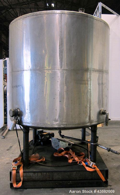 Used Tank, 1100 Gallon, 304 Stainless Steel, Vertical. Approximately 72” diameter x 60” straight side, dished top and bottom. Side bottom entering agitator with a 3 blade prop, driven by a 3/4 hp, 3/...
