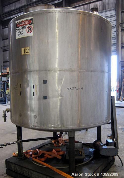 Used Tank, 1100 Gallon, 304 Stainless Steel, Vertical. Approximately 72” diameter x 60” straight side, dished top and bottom. Side bottom entering agitator with a 3 blade prop, driven by a 3/4 hp, 3/...