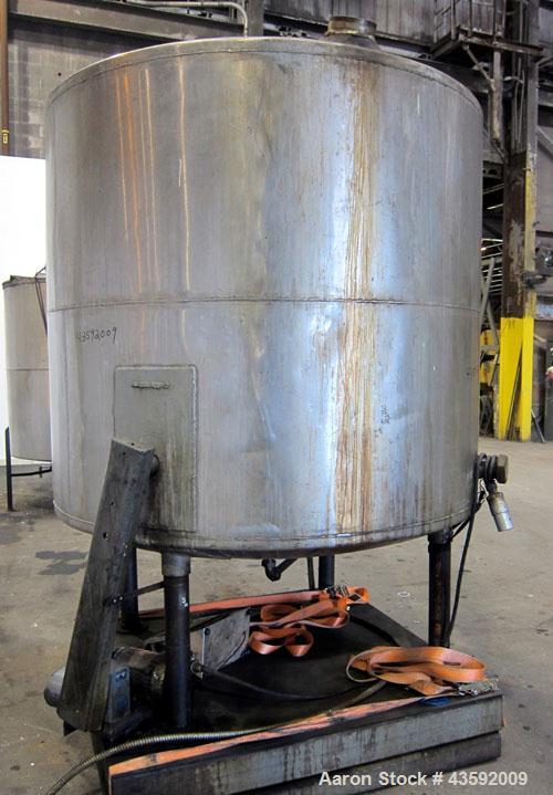 Used Tank, 1100 Gallon, 304 Stainless Steel, Vertical. Approximately 72” diameter x 60” straight side, dished top and bottom. Side bottom entering agitator with a 3 blade prop, driven by a 3/4 hp, 3/...