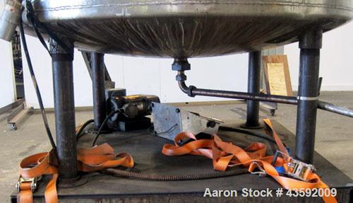 Used Tank, 1100 Gallon, 304 Stainless Steel, Vertical. Approximately 72” diameter x 60” straight side, dished top and bottom. Side bottom entering agitator with a 3 blade prop, driven by a 3/4 hp, 3/...