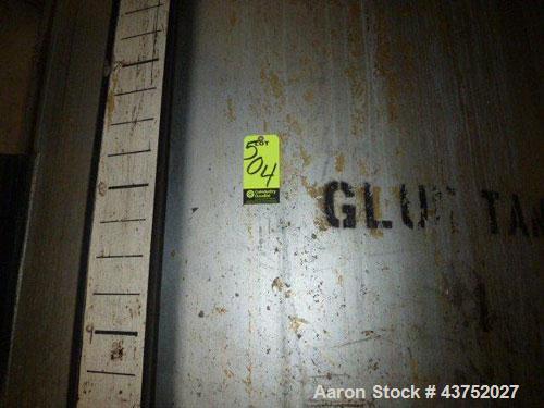 Used Tank, Approximate 4500 Gallon, Stainless Steel. Approximate 102" Diameter x 120" straight side. Flat top, dished bottom. Approxmate 7-1/2hp drive with 2 blades on shaft, (4) baffles. 2" Center b...