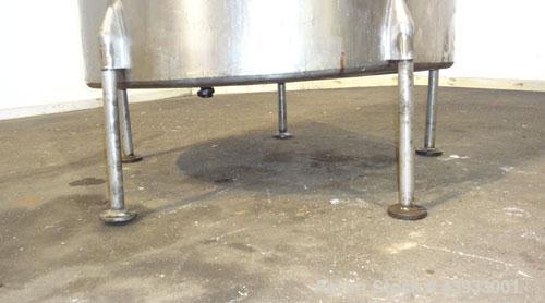 Used Tank, 1050 Gallons, 304 Stainless Steel, Vertical.  Approximately 62” diameter x 82” straight side.  Flat top, sloped bottom.  Off-center top entering Lightnin agitator, model N33G-150.  1-1/2” ...